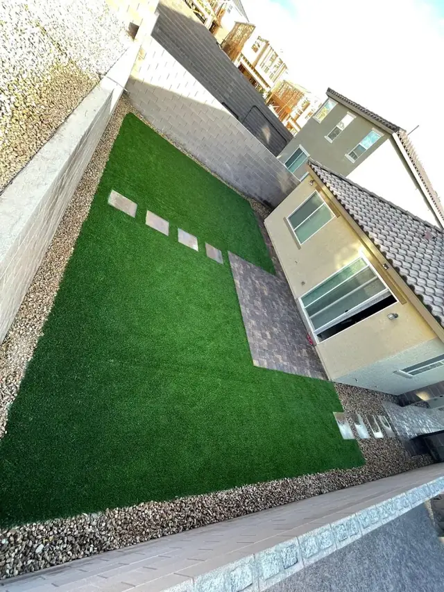 Side yard artificial turf with stepping pavers